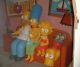 Simpsons life size Statues, Homer, Marge, Maggie, Bart, Couch, background